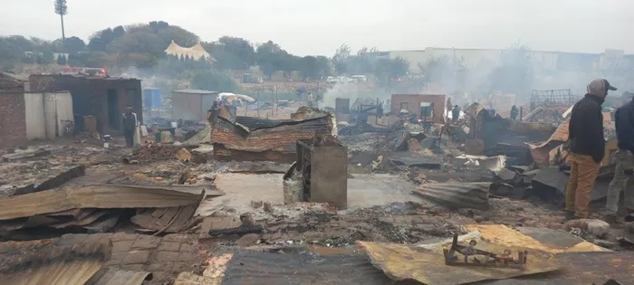 A fire claimed one life and left over 2000 people displaced when more than 800 shacks were engulfed in flames at Plastic View informal settlements. Photo: Tshwane Emergecy Services