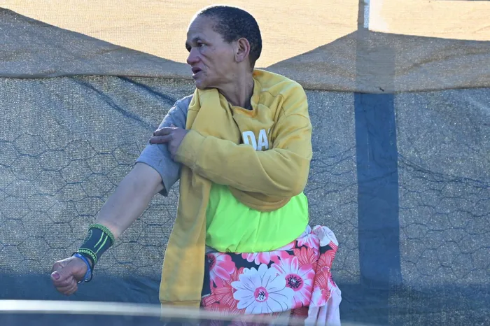 Sarah Plaatjies, 53, of the Masakhane township in Gansbaai, said she was attacked last month by a group of foreign nationals, who she said struck her with knobkieries and set their Jack Russell on her.