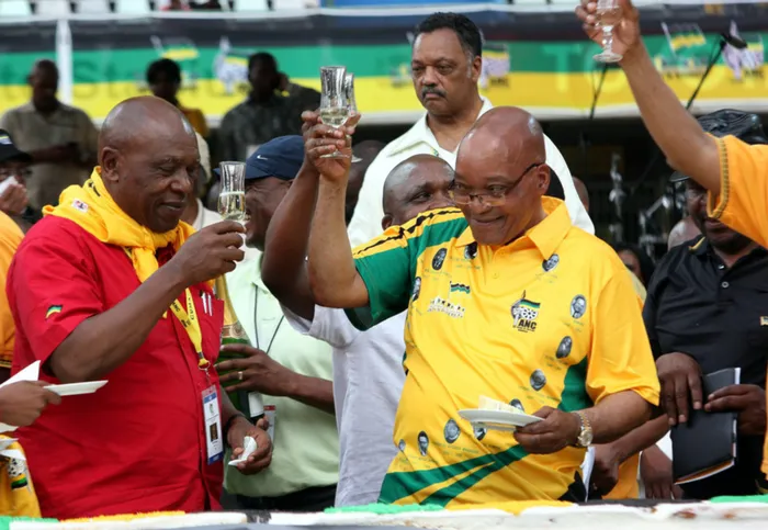 PARTY TIME: Tokyo Sexwale, left, and President Jacob Zuma share a toast in the packed Free State Stadium at the ANC's centenary celebrations held in Bloemfontein on Sunday. Zuma lost the plot in claiming unequivocal successes in every area of the ANC government administration, says the writer. Picture: Motshwari Mofokeng
