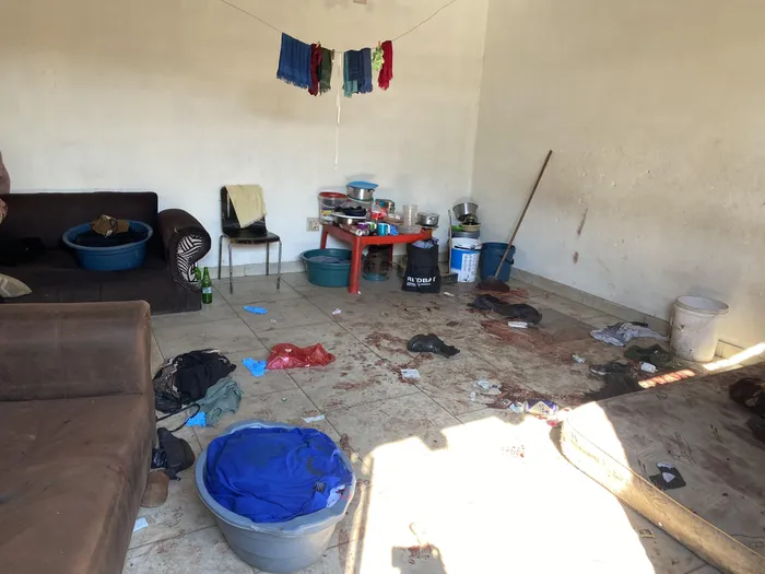 Bloodstains remained visible at the Jumpers informal settlement in Cleveland, Johannesburg, after a mass shooting on Tuesday night.