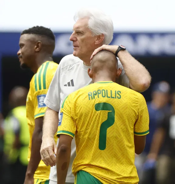 HUGO Broos seen comforting his Bafana Bafana players after their narrow stoppage time loss to Canada in the round of 32.