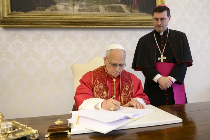 Pope Leo XIV signing his first Encyclical Letter “Magnifica Humanitas”, focused on the rise of artificial intelligence, on May 15 in The Vatican. 