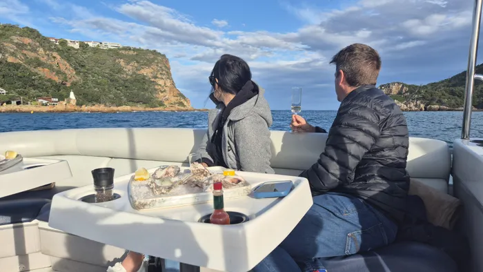 The Oyster Cruise aboard The Water Club combines a lagoon cruise with fresh oysters and MCC.