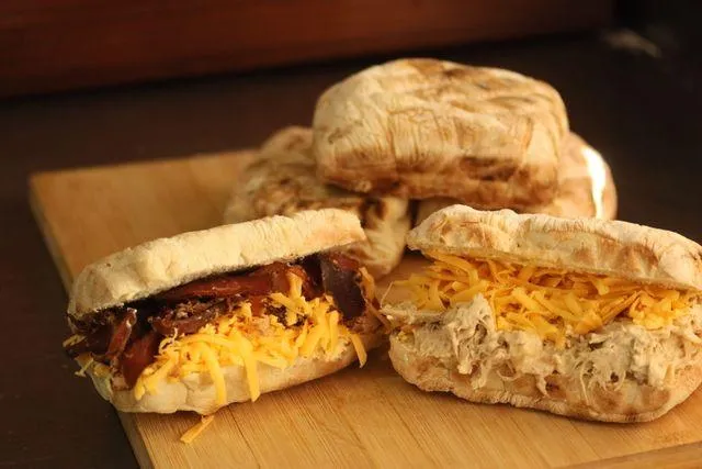 Elevate your late-night cravings with our Atchar-Spiked Braaibroodjie, a smoky, gooey sandwich filled with sardines, cheese, and a fiery vegetable atchar.