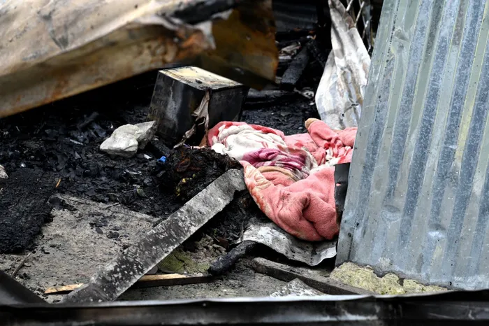 Emergency crews at the scene after a shack fire claimed the life of a 23-year-old in Kanana informal settlement, Gugulethu.