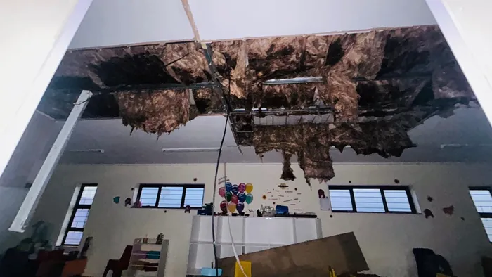 Water-soaked roof at Philisa Abafazi Bethu’s facility in Retreat following heavy rains, with flooding and structural damage disrupting services for women and children at the shelter.