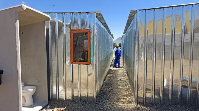 Disgruntled dwellers at the Royal Road informal settlement are unhappy about the tiny sink structures the City of Cape Town is now erecting for them. They claim that is not what they were promised initially. Picture:Ian Landsberg.