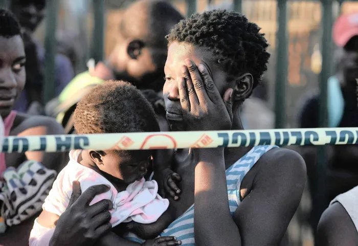 Residents watch in despair as shacks belonging mostly to Zimbabweans are set alight by taxi drivers. The country’s businesses have started counting the cost of the ongoing xenophobic attacks on foreigners. Photo: Bongani Shilubane/African News Agency (ANA)