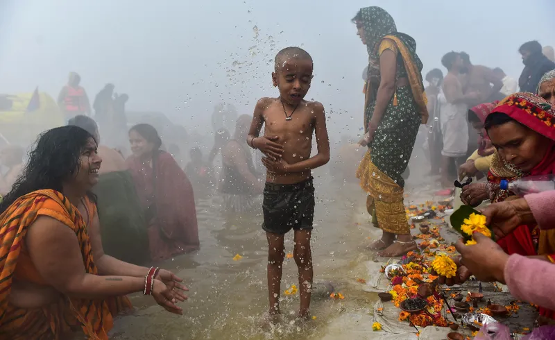 Flower petals showered on devotees as thousands take holy dip on Mauni Amavasya