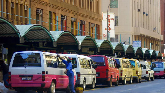 A taxi rank in downtown Jozzi.