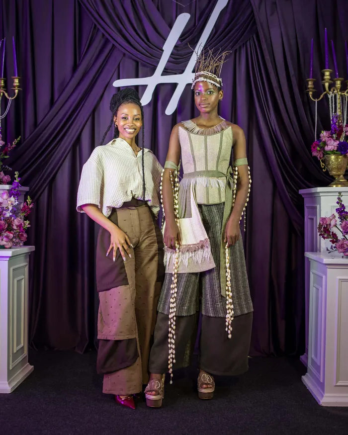 DUT fashion student Thato Selekane (left) stands with model Sinejabulo Magubane, 