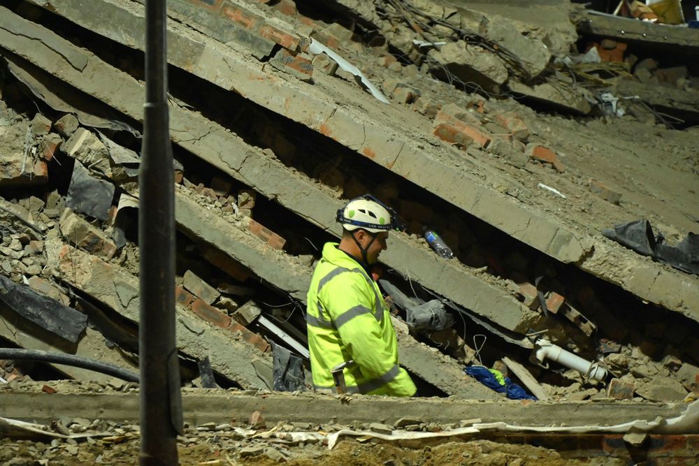 LISTEN: More staff may be trapped beneath rubble of collapsed building ...