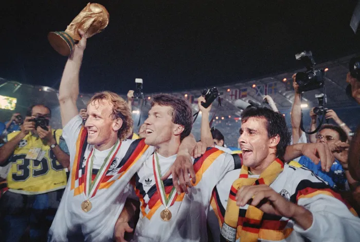 From left, West German defender Andreas Brehme, captain Lothar Matthaeus and Pierre Littbarski celebrate the victory after the Fifa World Cup final between West Germany and Argentina in 1990. Photo: AFP