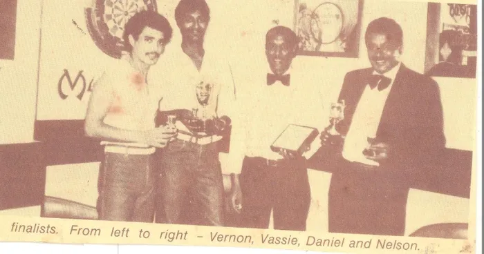 Poongavanam “Vassie” Chetty, second from left, with finalists at a darts championship in the 1970s. 