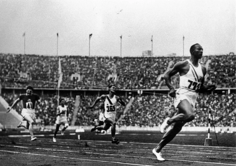 Jesse Owens running at the 1936 Olympics in Berlin. 