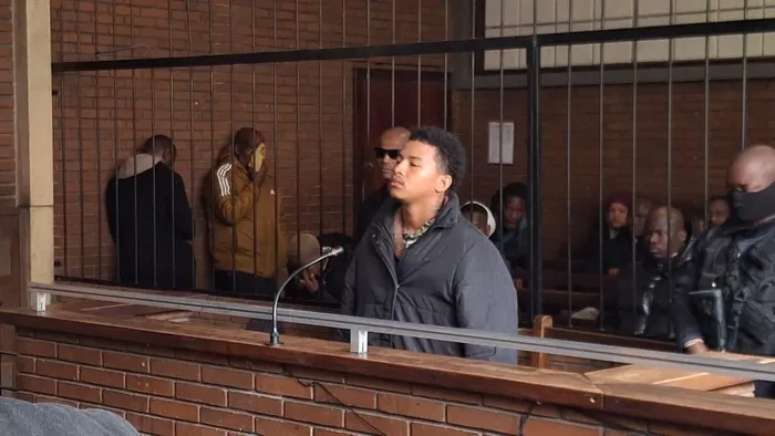Reagan Cheslin Collis, 23, who is accused by police of being the gunman; faces four murder charges, among others.