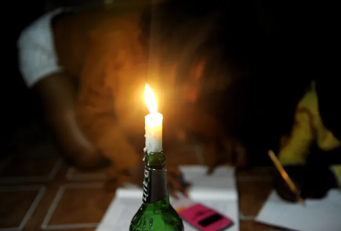 South Africa - Cape Town- 13 february 2019 Oletha Hagile and Yandisa HAgile from Mfuleni studying using a candle after Eskom stage 3 load sheeding. Photographer Ayanda Ndamane/African News Agency (ANA)