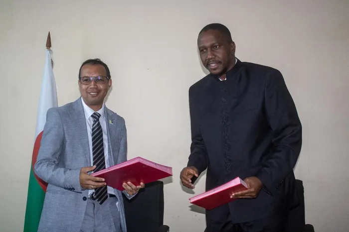 Madagascar Minister of Agriculture Rasatarima Jose Nitina after signing an agreement with Tefla Africa CEO, Gaius Mwangana King 