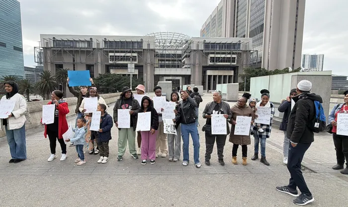 Activists outside Cape Town Civic Centre raising awareness about the need for more information on the construction of data centres in communities. 